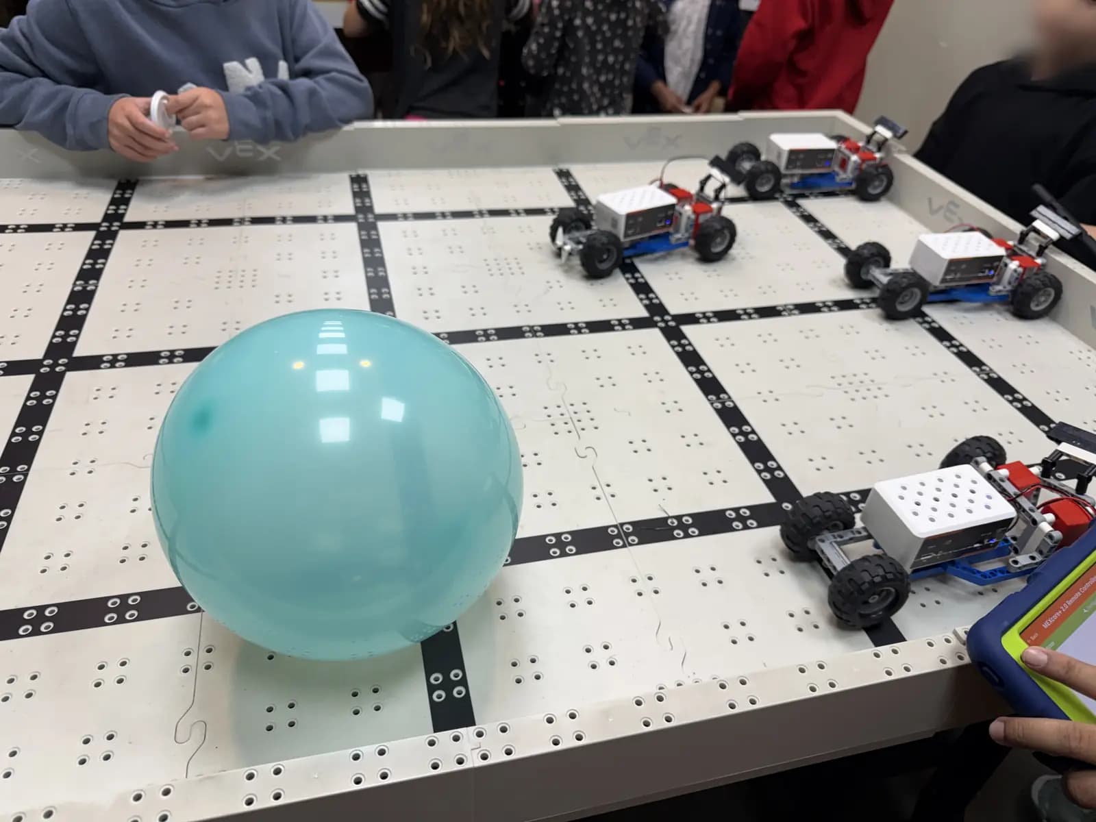 Robots and balloons on the arena at a birthday party in our Magnolia lab